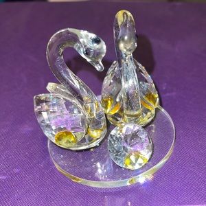 Clear and hint of yellow glass swan pair display